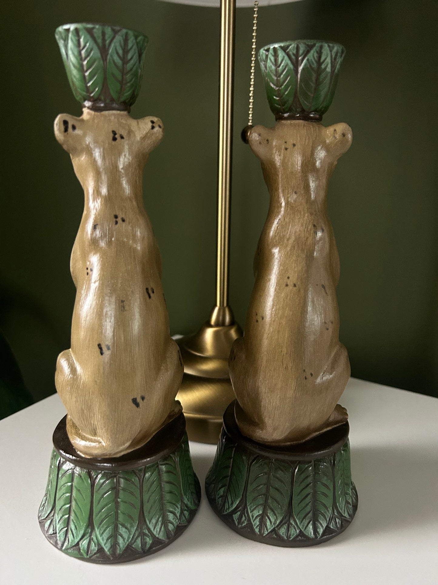 Pair of leopard and leaf candlestick holders