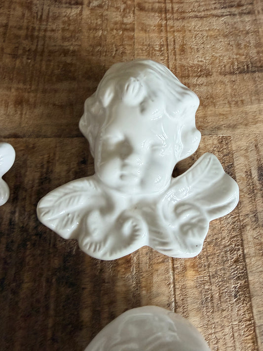 Set of 4 vintage French ceramic cherub wall hangings
