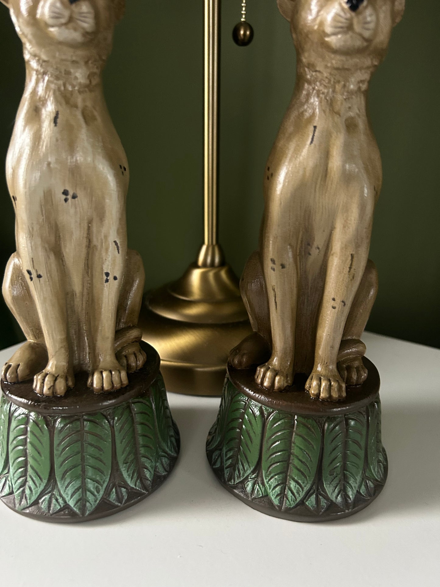Pair of leopard and leaf candlestick holders