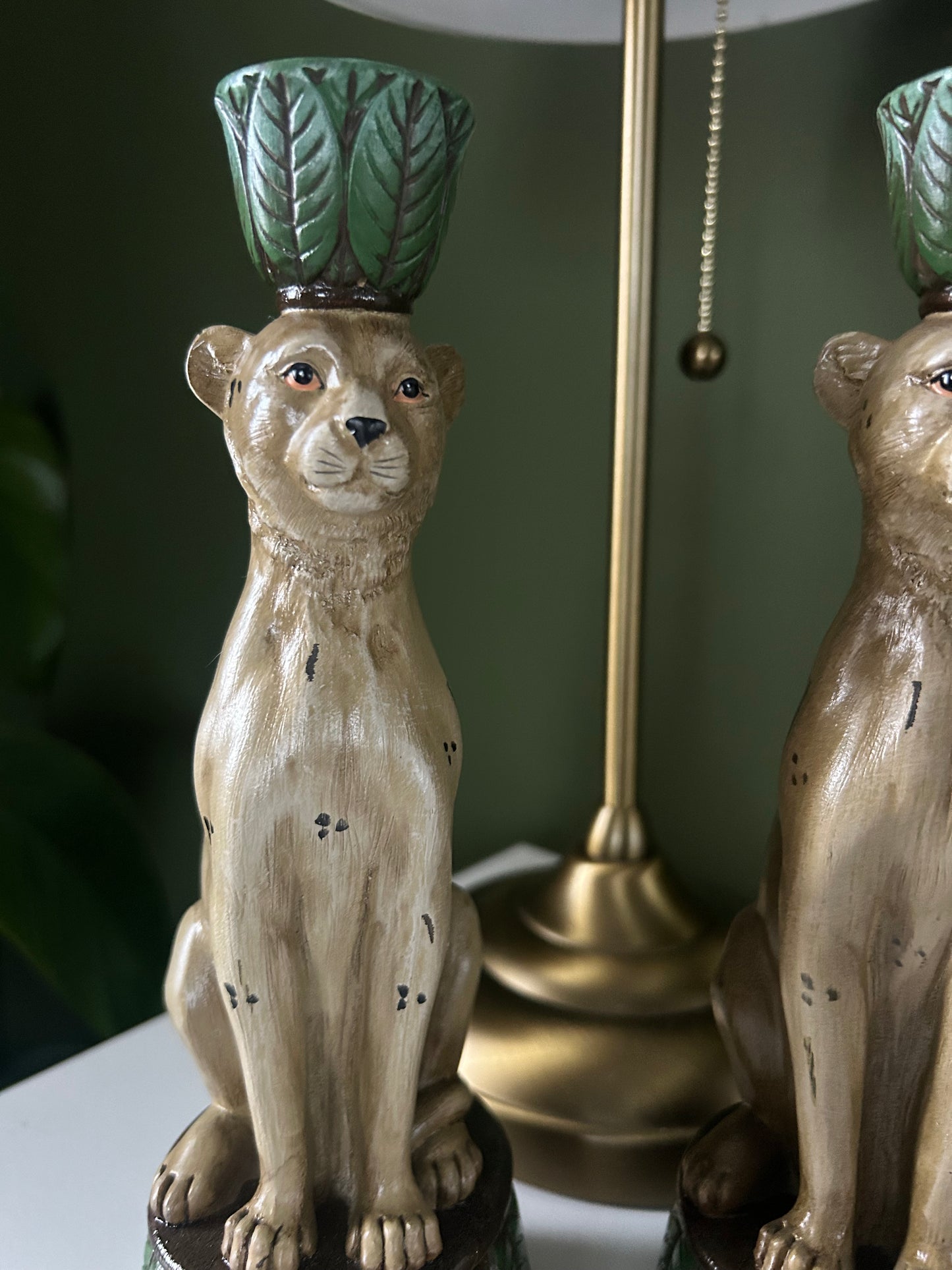Pair of leopard and leaf candlestick holders