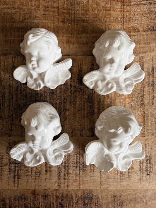 Set of 4 vintage French ceramic cherub wall hangings