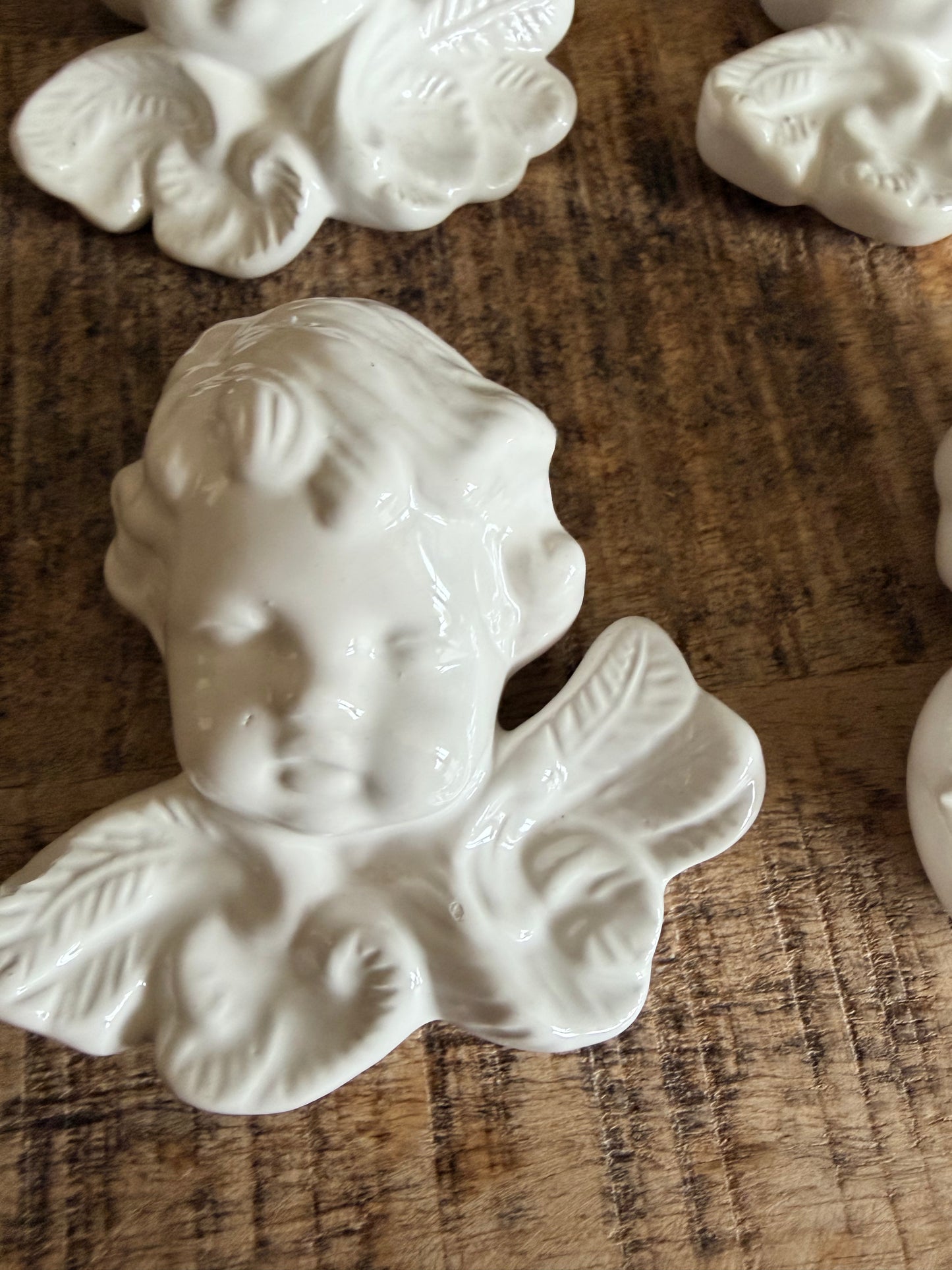 Set of 4 vintage French ceramic cherub wall hangings