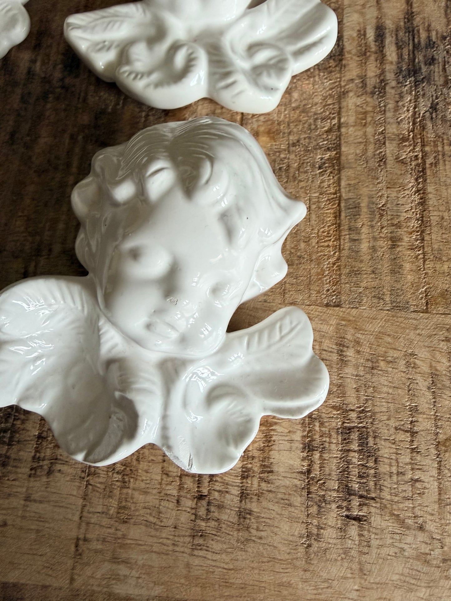 Set of 4 vintage French ceramic cherub wall hangings